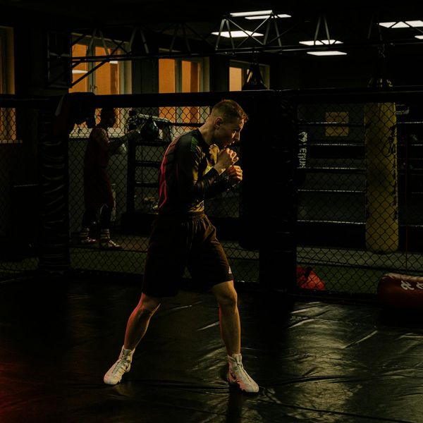 Man focused during a workout session, showing concentration and determination.